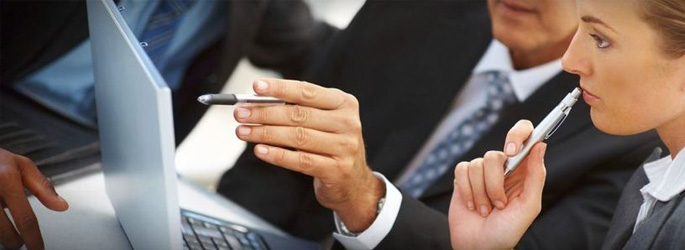 group of professionals at a conference table