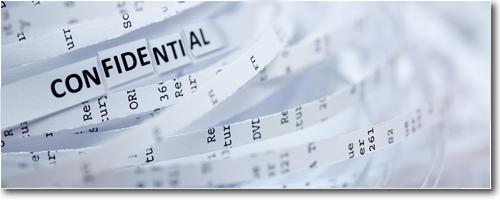 Shredded documents spelling out the word CONFIDENTIAL.